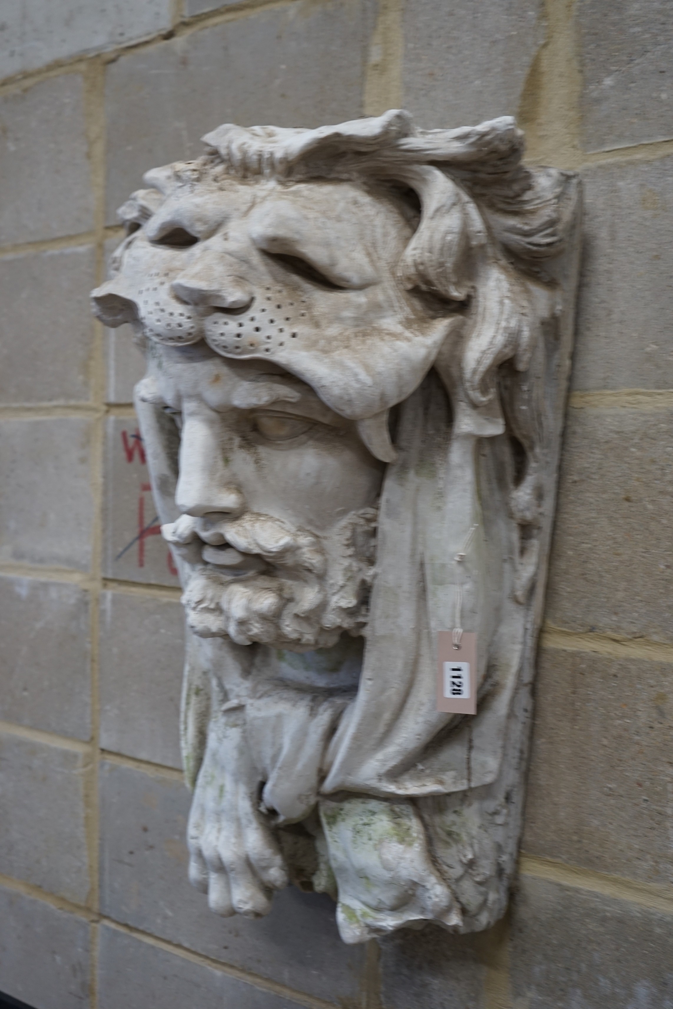 A cast plaster wall mask of Hercules, width 48cm, height 77cm